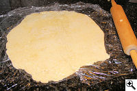 Rustic savory galette dough rolled out into 14-inch circle.