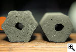 Side by side comparison of old and new Kamado extruded coconut charcoal